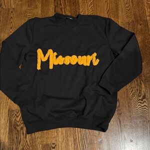 Black sweatshirt with gold chenille Missouri lettering large